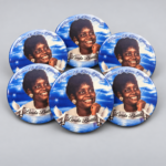 Blue personalized memorial photo buttons honoring Linda Battle