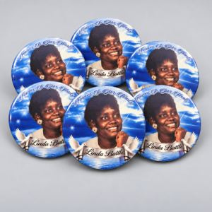 Blue personalized memorial photo buttons honoring Linda Battle